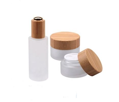 Le cosmétique vide rond en verre cogne l'emballage cosmétique en bambou naturel de conteneur