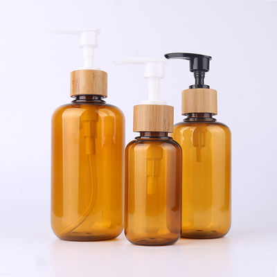 Amber Glass Bamboo Cosmetic Bottle avec le pulvérisateur en bois de lotion de gravure de chapeau