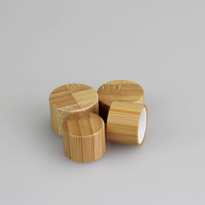 le couvercle à visser 28mm en bambou de 24mm pour les fermetures supérieures de disque cosmétique de bouteille écrèment la capsule