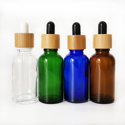 Bouteille en verre d'huile essentielle avec la petite bouteille d'huile de compte-gouttes résistant en bambou d'enfant